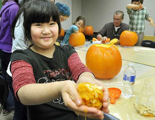 Kids get out their knives and cut into the heart of the matter during a pumpkin-carving extravaganza at Steveston Community Centre.