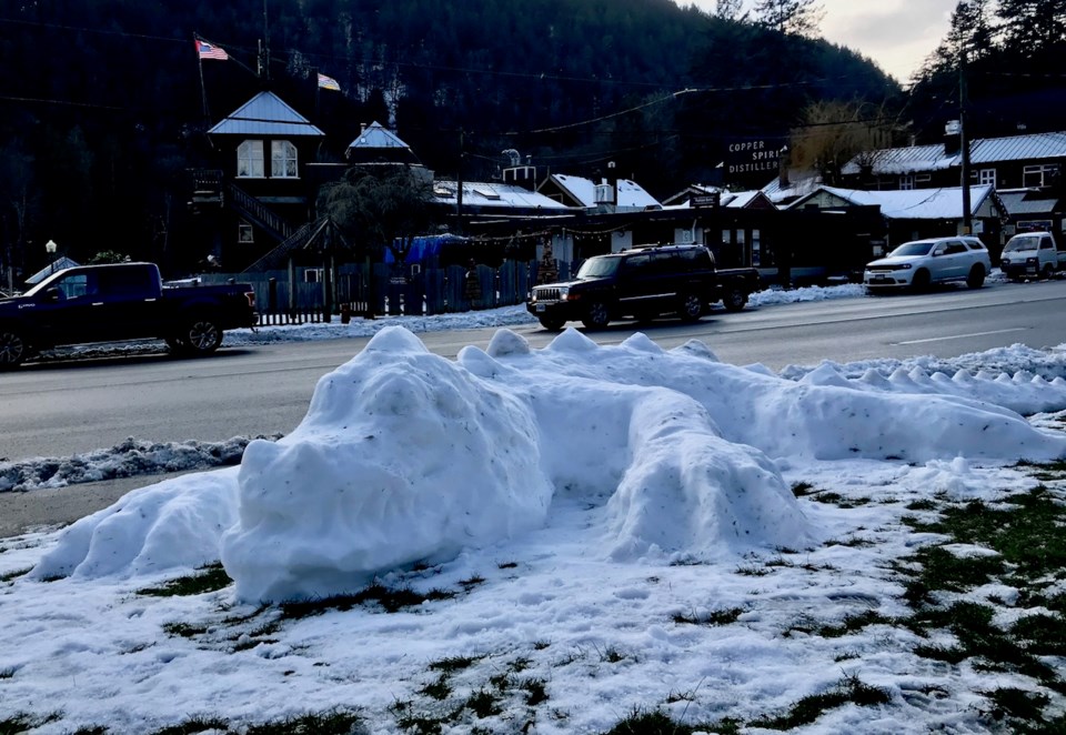 Snow dragon on the lawn of the library