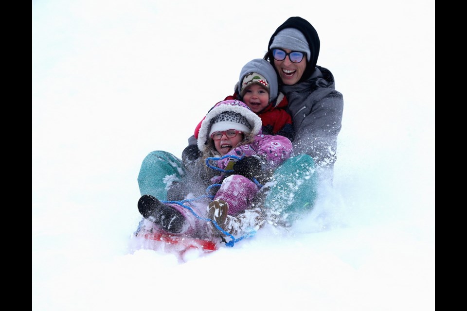 Dana Easton and her kids Lucia, 4, and Elena, 2, toboggan at Beacon Hill Park on Dallas Road on Jan. 15, 2020.