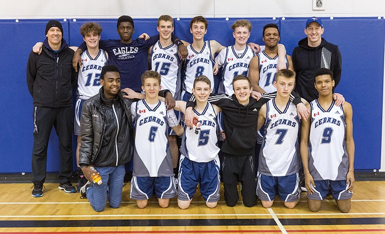 Citizen Photo by James Doyle. The Cedars Christian School Eagles pose for a team photo on Saturday evening after defeating the PGSS Polars to win the Kelly Road Sr. Boys basketball tournament.