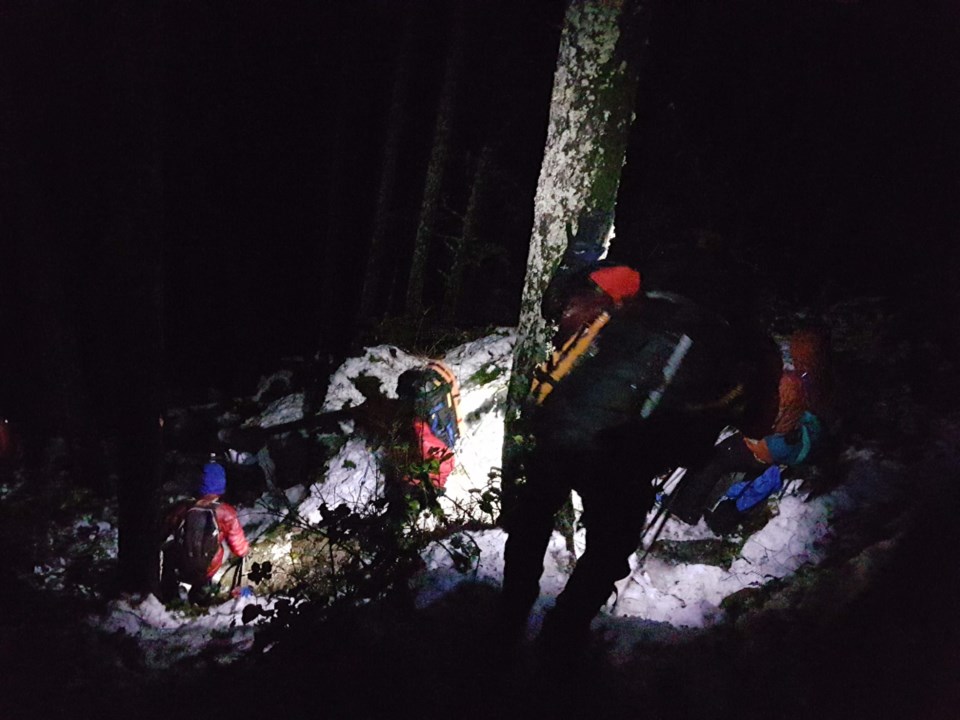 A party of 12 — including seven rescuers — descend Swan Falls trail.
