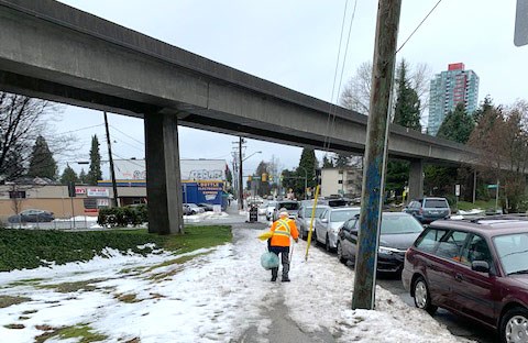 A senior struggles to walk along an uncleared sidewalk in Burnaby at Imperial and Jubilee. contributed photo