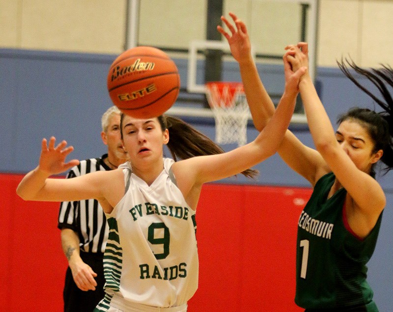 MARIO BARTEL/THE TRI-CITY NEWS
Riverside Rapids guard Brooke Kendal battles Lord Tweedsmuir forward Puneet Dhindsa for a loose ball in the first half of their opening round game at the 37th annual Top Ten Shootout, Thursday at Coqutilam's Centennial secondary school. Kendal scored 16 points, while teammate Sammy Shields netted 42, to help Riverside win, 94-49.