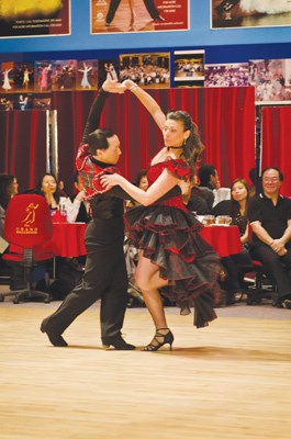 Laura Van Sprang, of Richmond Funeral Home, dances with Andy Wong.