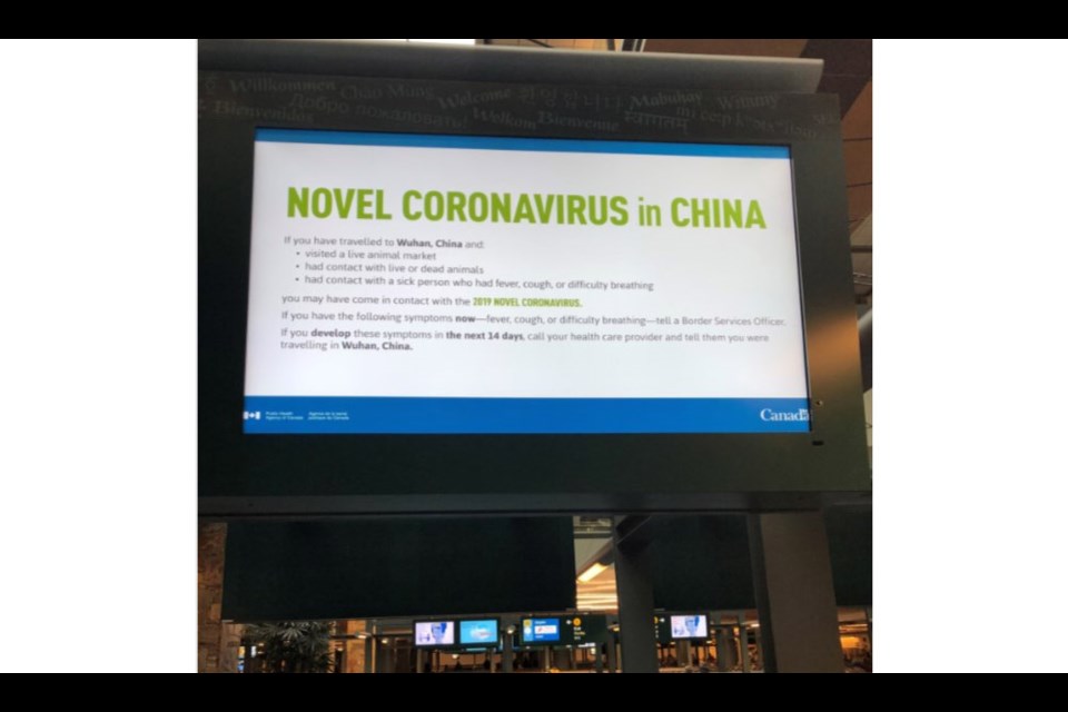 One of the many signs now up at YVR, warning travellers to look for symptoms of the coronavirus in China. Photo submitted
