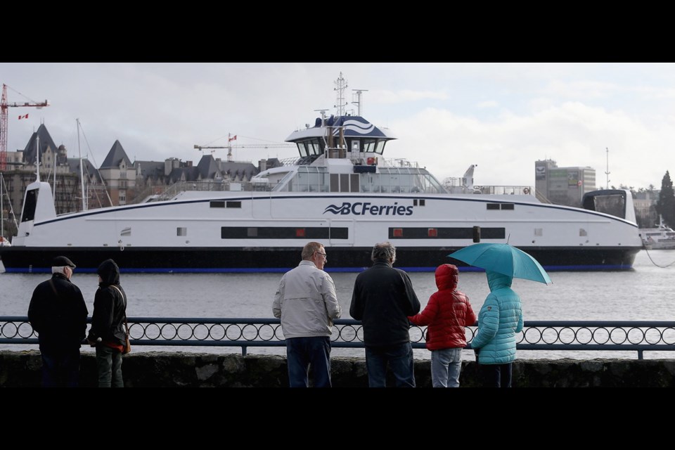 People come put as two new Island-class ferries were unloaded and floated into Esquimalt Lagoon, and then individually towed by tug through Victoria Harbour, under the Johnson Street bridge, and then tied up at Point Hope Maritime.