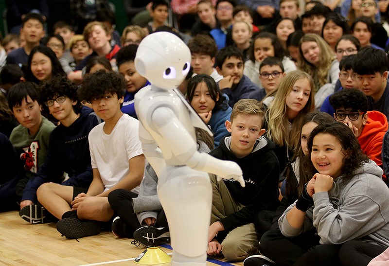 Pepper, a programmable robot, was introduced to cheering Scott Creek middle school students in Coquitlam Wednesday. Ten of these have been donated to School District 43 by Finger Food Advanced Technology Group, a tech company based in Port Coquitlam, in an initiative to help students learn coding.