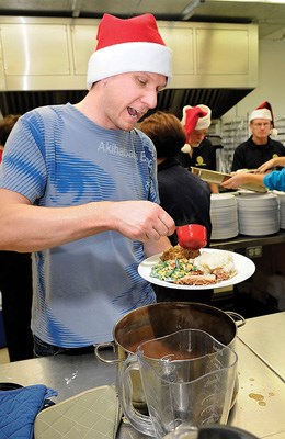 Kelly Jablonski (left) shouts for more gravy as this pot is almost empty.