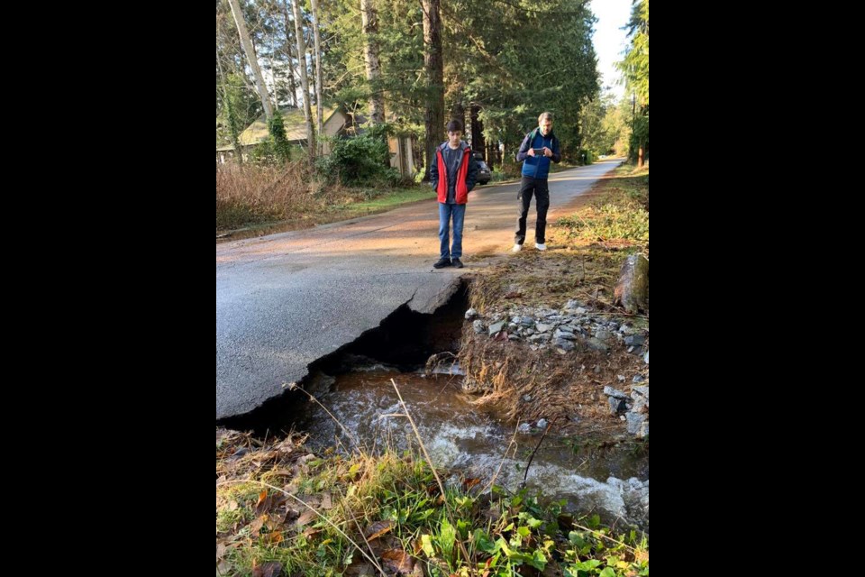 Beach Avenue is half washed away at Camp Douglas, between Margaret and Park Avenue. Flume Creek has undercut a large chunk of road, and the asphalt is giving way.