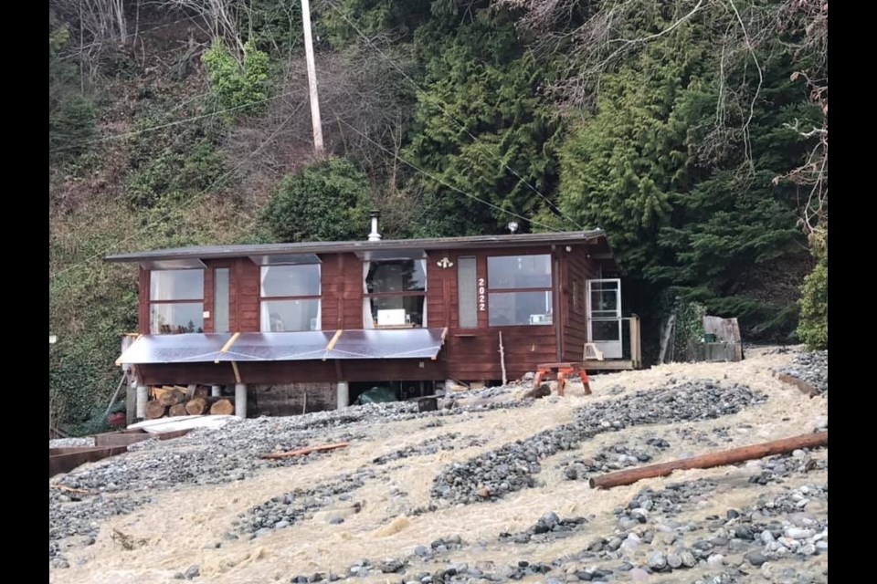 Debris is piled high around homes on Ocean Beach Esplanade and at least one home has sustained damage.