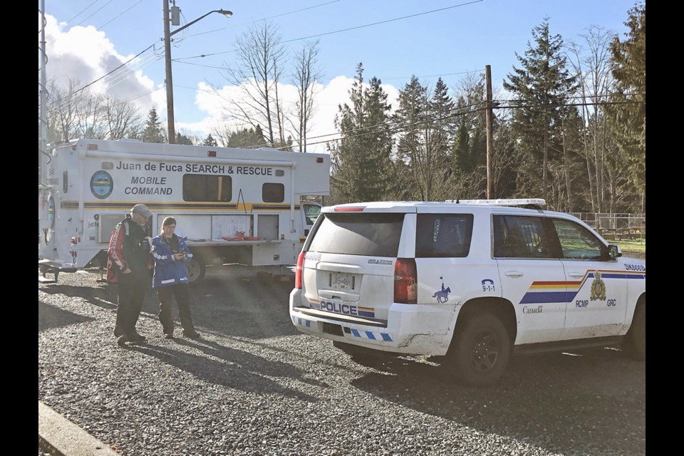 Search and rescue staff and RCMP co-ordinate during the search for missing man A.J. Jensen on Monday.