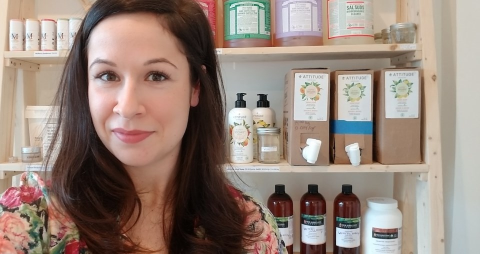 Kennedy in front of some of her products.