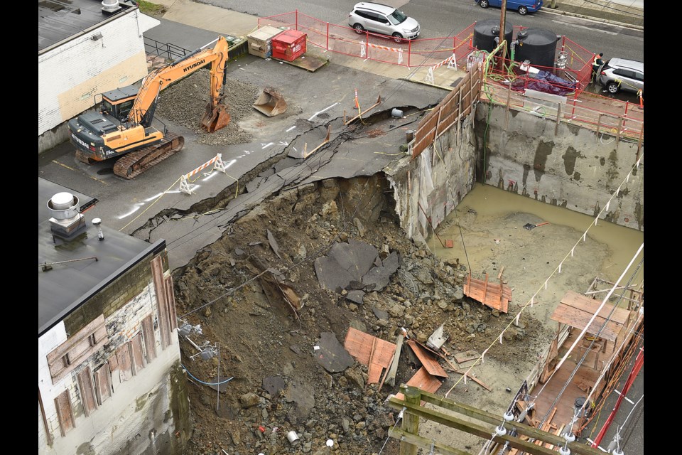 On Jan. 31, the retaining wall of a construction site came down during heavy rainfall on, causing a section of the Congee parking lot to cave in and slide into the neighbouring excavation pit. Photo Dan Toulgoet