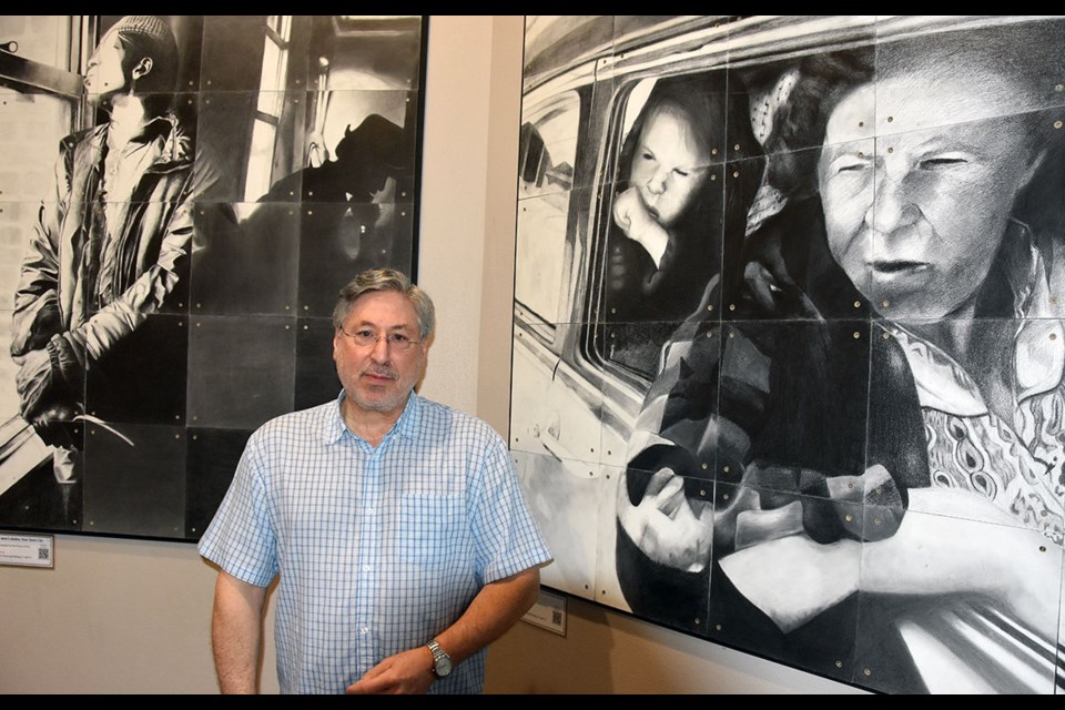 Pinetree art teacher Brian Gleckman pictured with Trolley (at right).