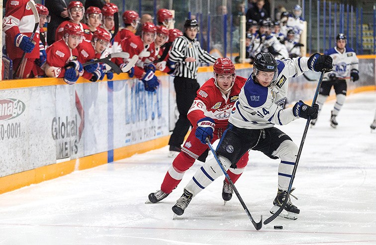 Citizen Photo by James Doyle. Prince George Spruce Kings players look on as forward Wil Kushniryk pressures Wenatchee Wild defender Dylan Herzog on Wednesday night at Rolling Mix Concrete Arena.