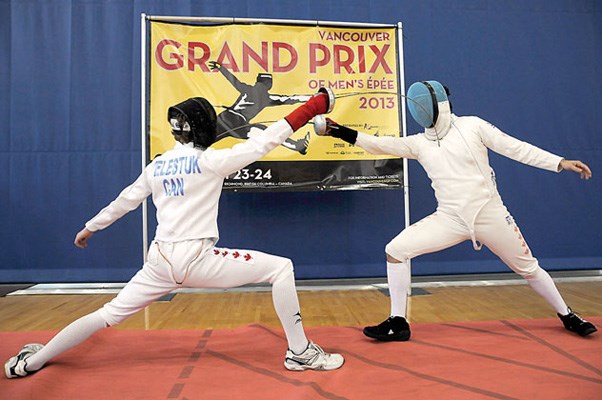 Igor Gantsevich fences 17-year-old Isaac Velestuck in a friendly challenge at the Richmond Olympic Oval.