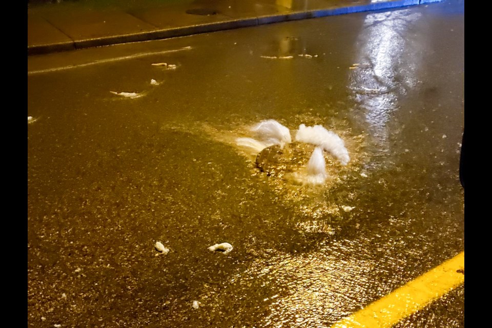 A manhole along North Road spewed sewage onto the street in front of Oakdale Park during torrential rains Jan. 31.