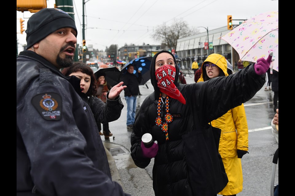 Protesters blockading the Port of Vancouver entrance at Hastings and Clark Thursday afternoon expressed anger at Vancouver police officers after a driver slipped past the police perimetre and accelerated towards the protesters before screeching to a halt. Photo Dan Toulgoet