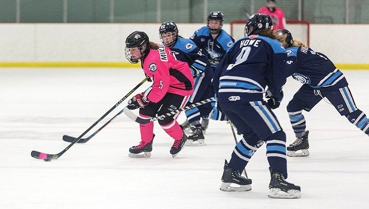 Citizen Photo by James Doyle. Northern Capitals defender Kiera Mulder skates the puck into the offensive zone against the Thompson Okanagan Lakers on Friday evening at Kin 2. The Capitals were wearing special pink jerseys for their Pink in the Rink Night.