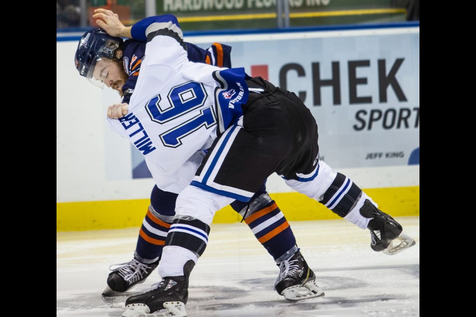 Victoria Royals' Carson Miller and Kamloops Blazers' Zane Franklin square off in a first-period fight in WHL action at Save-on-Foods Memorial Centre on Saturday.