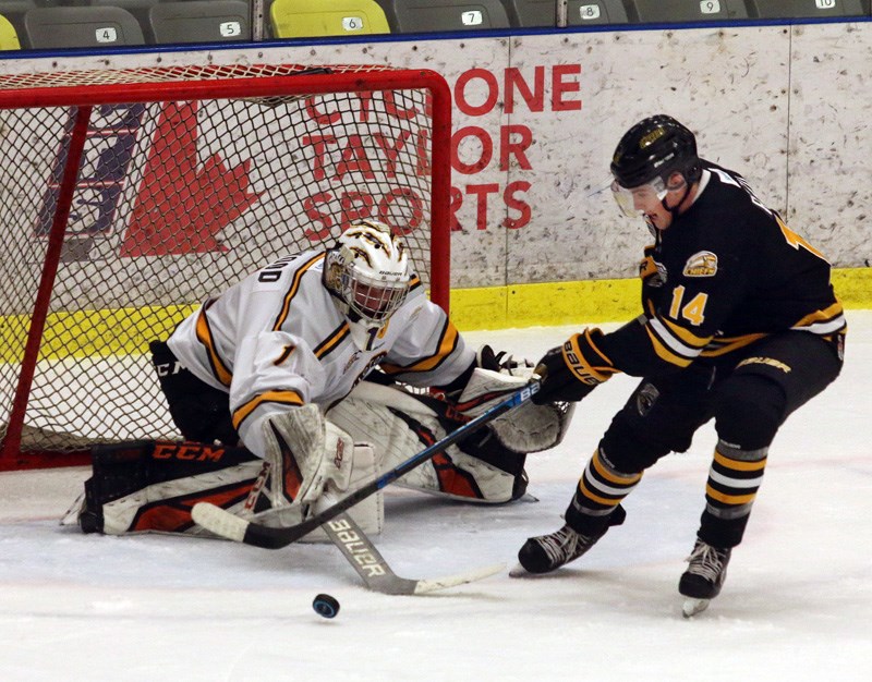 MARIO BARTEL/THE TRI-CITY NEWS
Coquitlam Express forward Massimo Rizzo is thwarted on a scoring attemp by Victoria Grizzlies goalie Blake Wood in the first period of their BC Hockey League game, Saturday at the Poirier Sport and Leisure Complex. The Express won, 6-3.