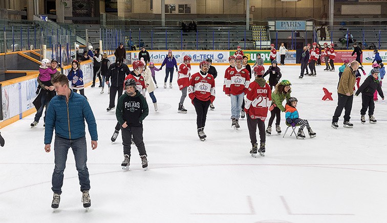 Citizen Photo by James Doyle. The Prince George Spruce Kings skate with members of the public on Sunday at Rolling Mix Concrete Arena during the Skate for Literacy fundraiser.