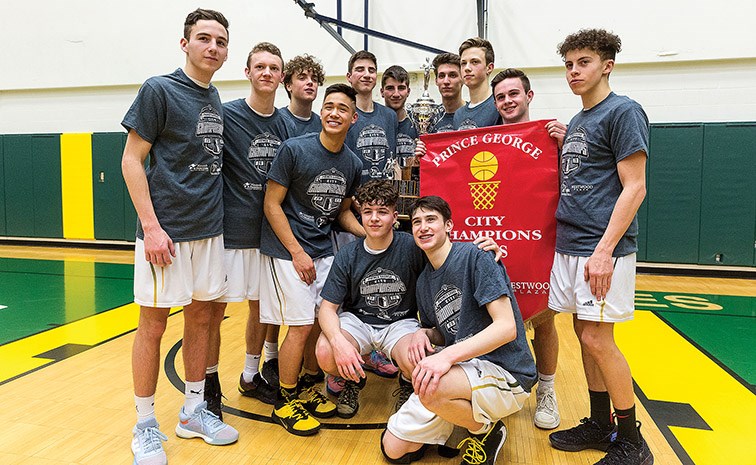 The Duchess Park Condors pose with their trophy and banner Tuesday after claiming their fifth consecutive Prince George senior boys high school basketball city championship after defeating the D.P. Todd Trojans 66-43 at the NSC.