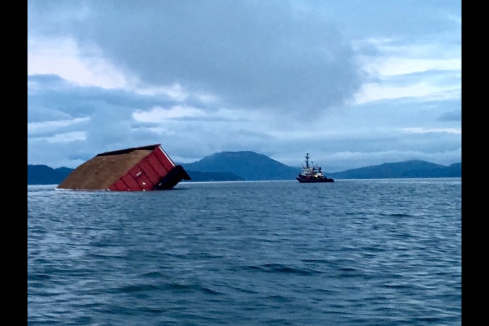 A barge full of wood chips tipped and dropped part of its load into the water near Salt Spring Island on Wednesday.