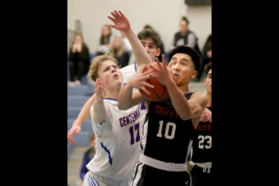 MARIO BARTEL/THE TRI-CITY NEWS
Centennial Centaurs forward Leif Skeldings battles to wrest a rebound from Terry Fox Ravens guard Kenny Kogoy in the first quarter of their BC High School Basketball Association AAAA game, Tuesday at Centennial secondary in Coquitlam. The Centaurs won, 81-69. Both teams had been undefeated in league play heading into the game. The regular season wraps up tonight (Thursday). Centennial plays Dr. Charles Best Blue Devils, 7:30 p.m., at Best. Fox hosts Heritage Woods Kodiaks, 7:30 p.m., at Terry Fox secondary in Port Coquitlam, while the Port Moody Blues concludes its season at Maple Ridge.