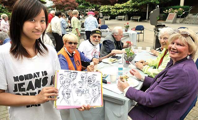 The annual Picnic at Brighouse Square, organized by Minoru Senior Centre took place on Wednesday. It was filled with delicious treats, and some fun activities, like caricature drawings by Jennifer Li.
