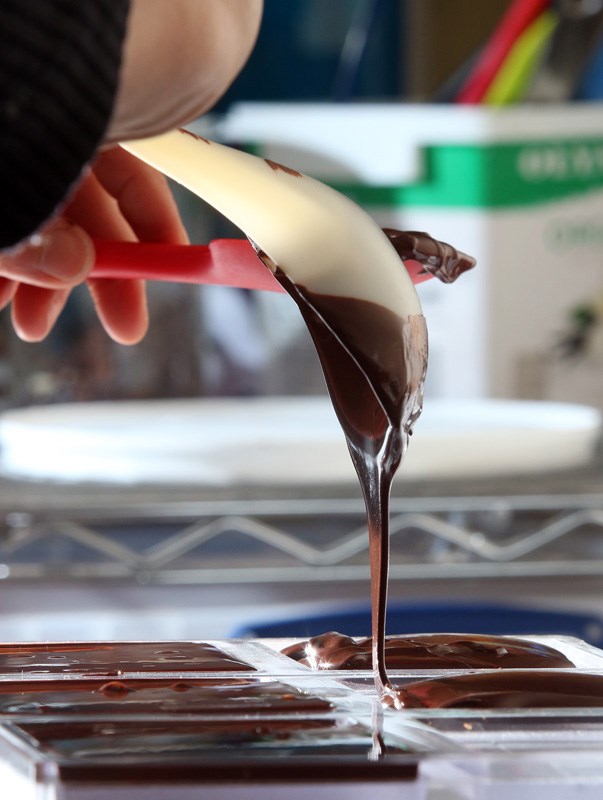 Chocolate made from bean to bar shown here poured into moulds