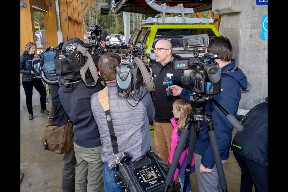 Camera crews surround the Sea to Sky Gondola's Kirby Brown.