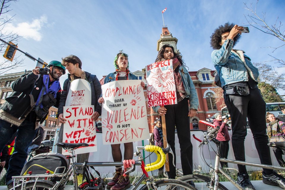 Wet'suwet'en supporters picket in front of 1515 Douglas St. near Victoria City Hall.