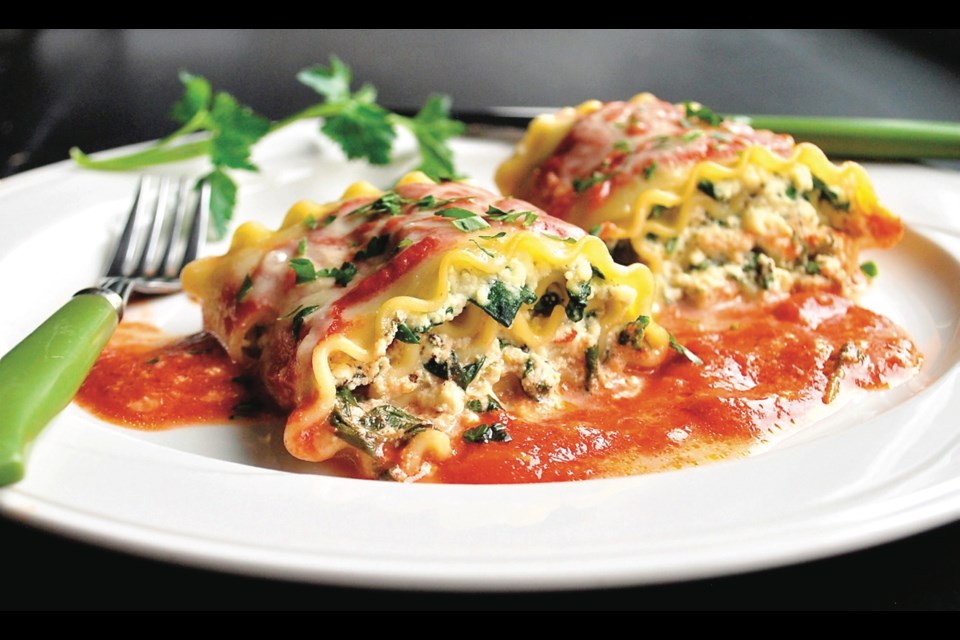 Lasagna noodles are rolled with a ricotta spinach filling, sauced, topped with mozzarella cheese and baked.