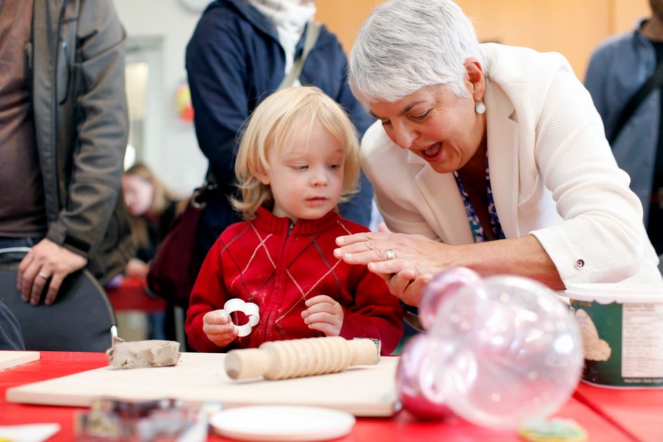 B.C. Minister of Finance Carole James takes part in activities with Arlo Pullman, 3, during the Family Arts Festival at the Cedar Hill Recreation Centre on Family Day in Saanich. Feb. 17, 2020
