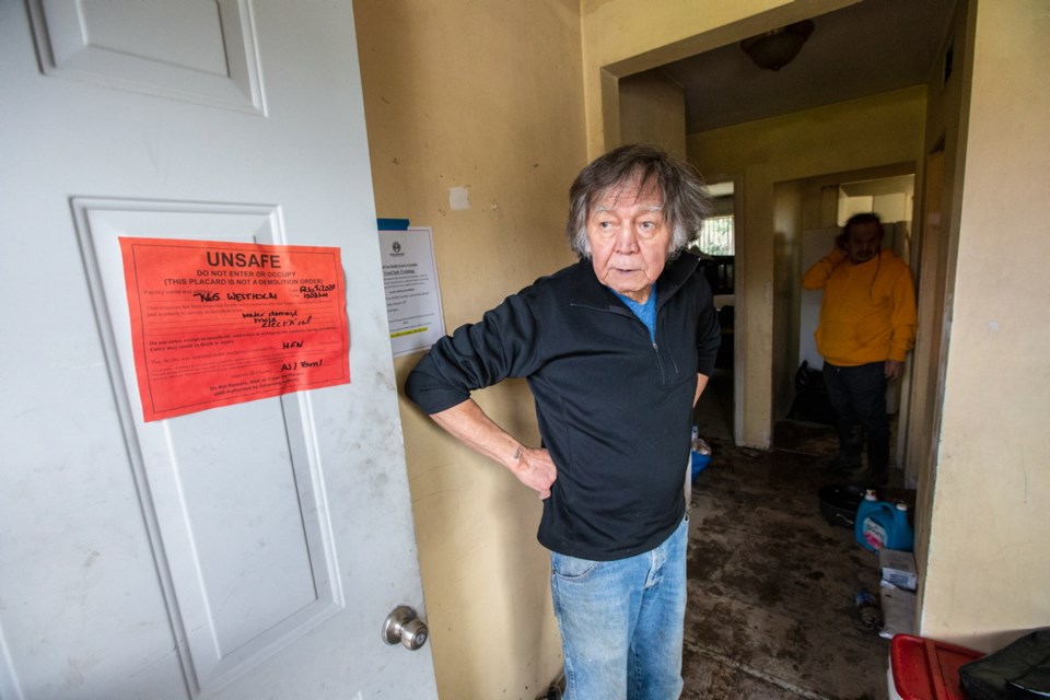 Halalt First Nation elder Garry Norris at the front door of his flood damaged home, which has been deemed unsafe by the Cowichan Valley Regional District.