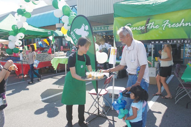Kin's staff handed out food and drink samples to customers at Saturday's celebrations.