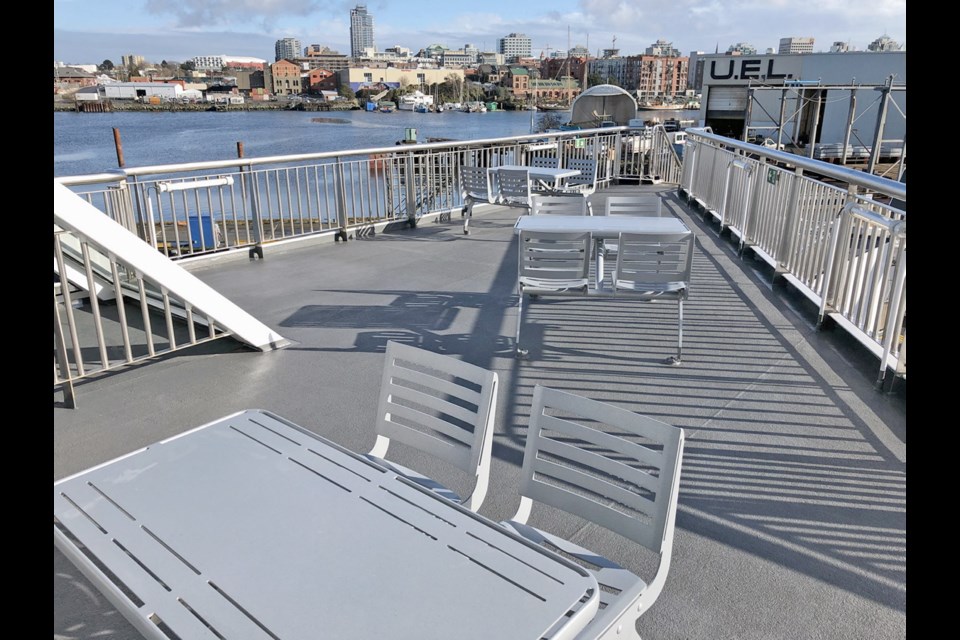 Outer deck seating on a B.C. Ferries hydbrid-electric vessel.
