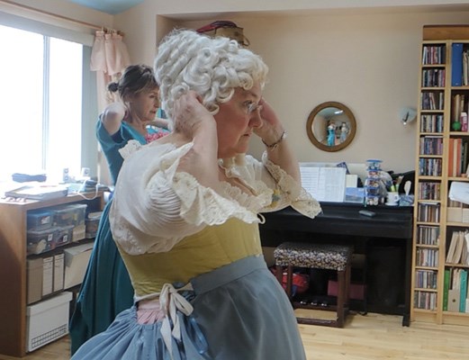 Catherine Lee and fellow member, performance artist Angela Brown prepare for a dress rehearsal in Lee's home studio.