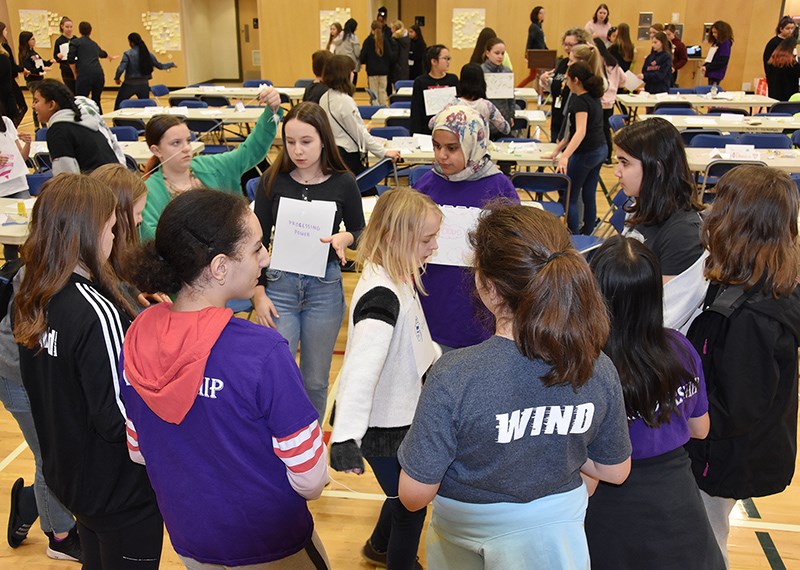 Students create a model of the internet using paper, string and their imaginations during a STEM 4 Girls Camp put on by IBM at Port Moody middle school Friday, Feb. 21.