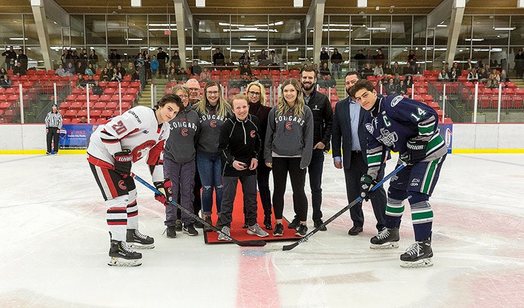 Citizen Photo by James Doyle. Jameson Jones, centre, drops the puck in a ceremonial face-off between the Cariboo Cougars and Fraser Valley Thunderbirds on Saturday evening at Kin 1 during the 10th Annual Jameson Jones Night.