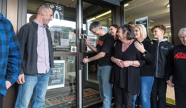 Long time employee Peter Mueller locks the doors at the Northern for the final time on Saturday afternoon.