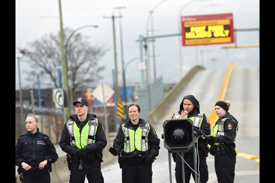Vancouver police Tuesday afternoon started arresting protesters who refused to leave the intersection of East Hastings and Clark Drive. Photo Dan Toulgoet