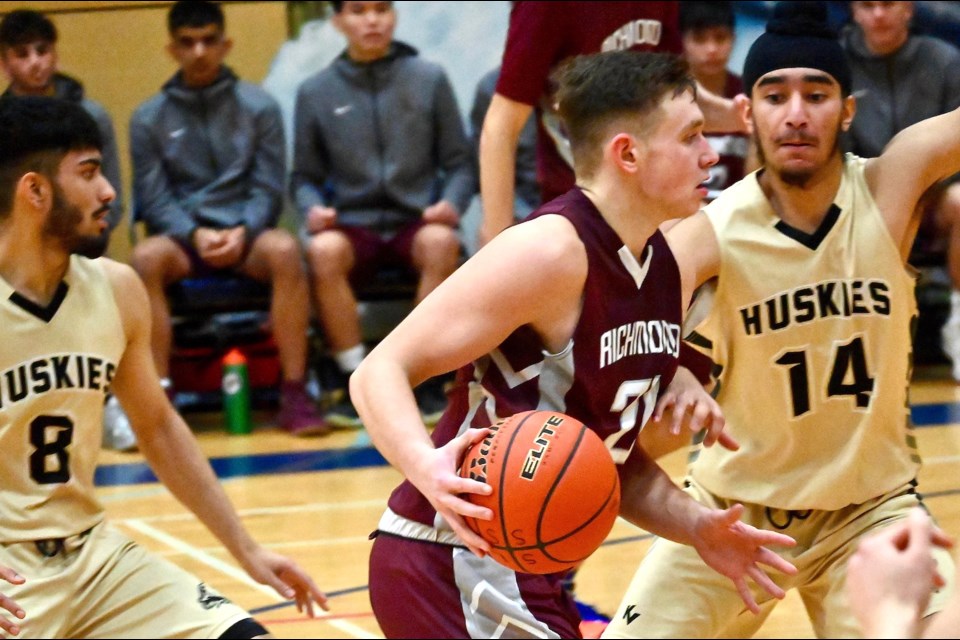 Arminas Ilciukas drives to the basket in the Richmond Colts 76-58 upset win over North Delta in quarter-final action on Tuesday night at the South Fraser 3A Championships. The victory sets up a semi-final game tonight against host Steveston-London while McMath and MacNeill meet one more time in the other final four encounter.