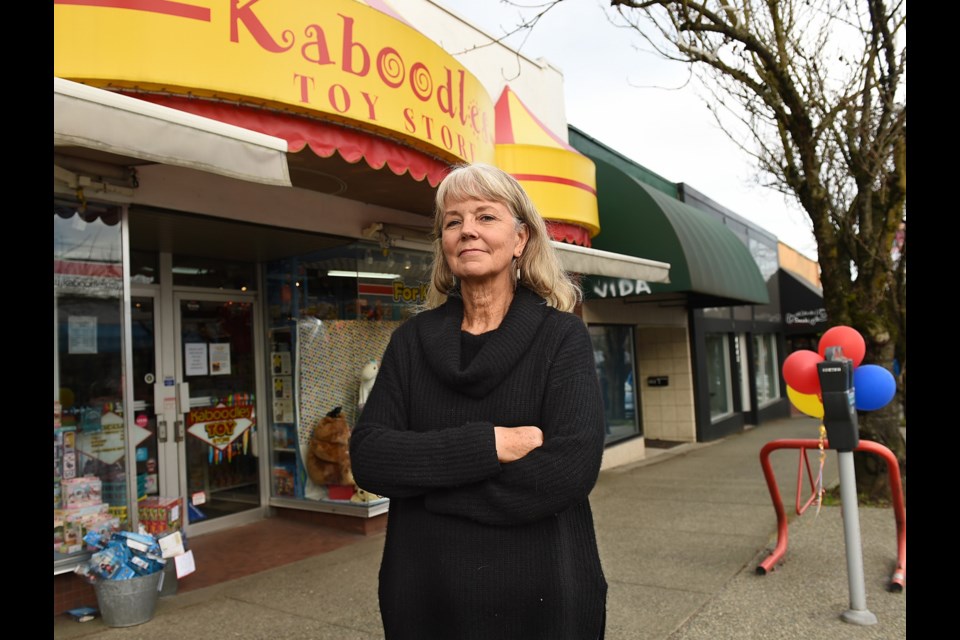 Kaboodles Toy Store owner Lee Richmond outside her business on West 10th Avenue, which is in the process of closing due to escalating rents and property taxes.