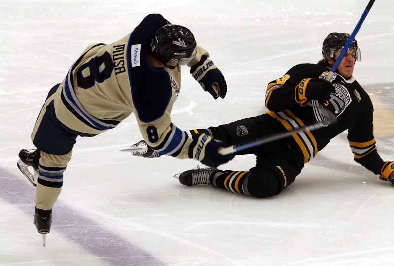 Coquitlam Express player crashing to the ice