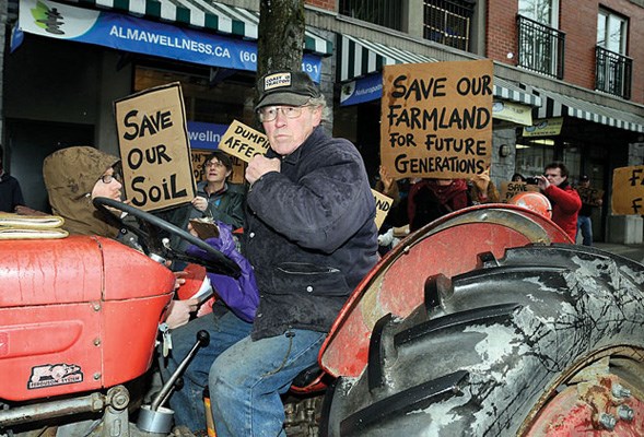 Ray Galawan led a convoy of tractors to Premier Christy Clark's office in Point Grey to protest over alleged dumping of construction waste on farmland.