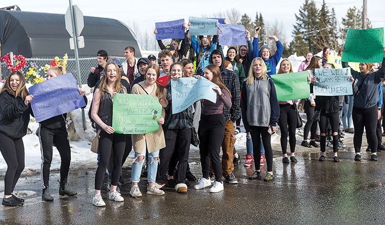 Students held a rally just off school grounds on Wednesday afternoon to protest the proposed name change for the new school under construction to replace Kelly Road Secondary School.