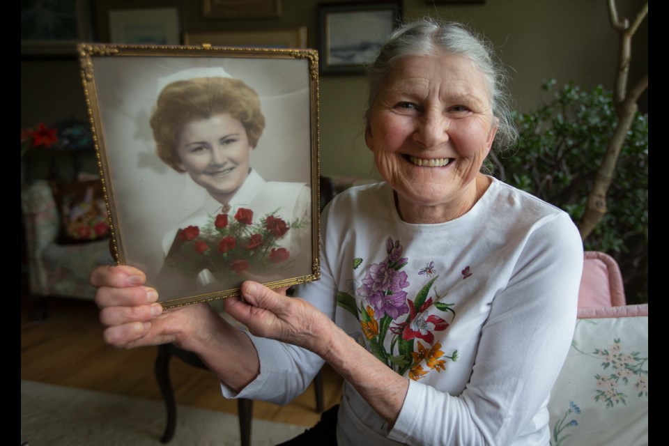 Retired nurse Stella Morris, 77, with her graduation photo.