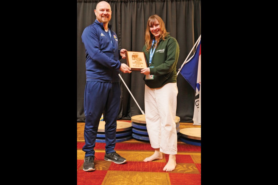 Leah Pearson-White receiving the Female Sportsmanship Award for Karate at the BC Winter Games.